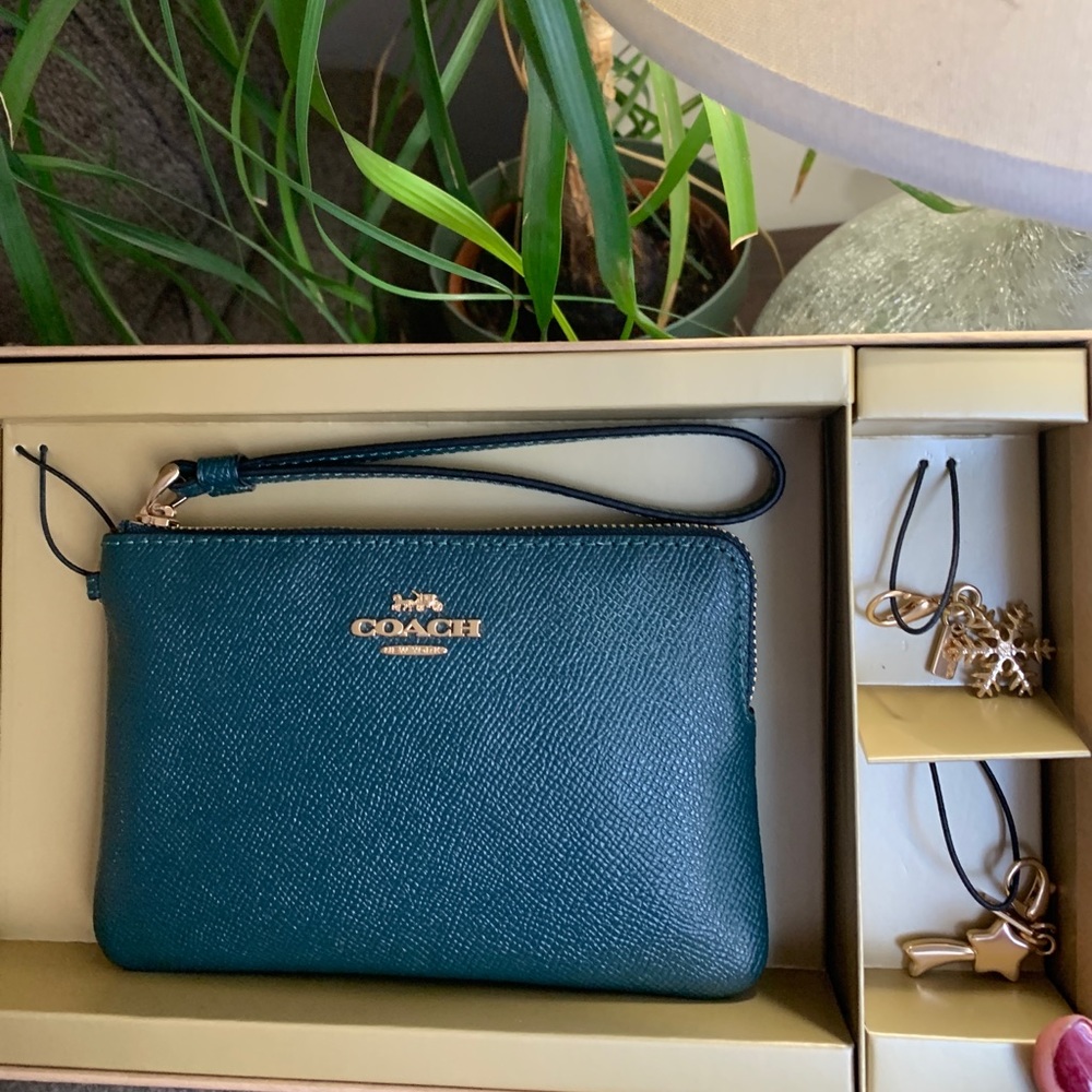 Authentic COACH Leather zip wristlet & 2 charms set